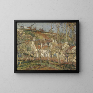 Coin de village sous la neige avec des toits rouges - Camille Pissarro — framed artwork on a wall