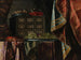 Nature morte with a chest, fruits, and other objects on a brocade-draped table - Carlo Manieri — artwork view