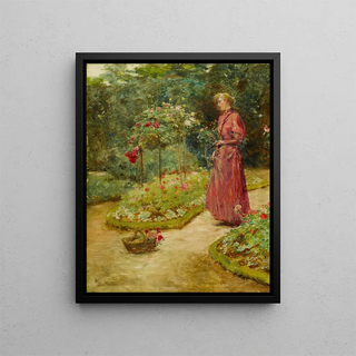 Woman cutting roses in a garden - Childe Hassam — framed artwork on a wall