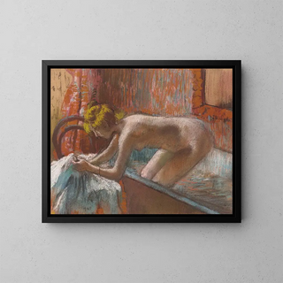 a woman emerging from the bath - Edgar Degas — framed artwork on a wall