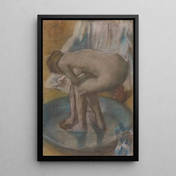 Woman bathing in a shallow bathtub - Edgar Degas — framed artwork on a wall