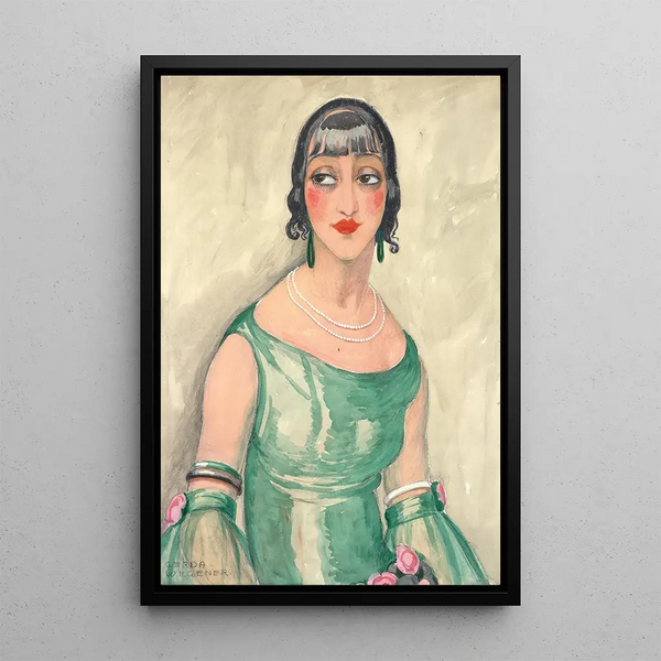 Portrait of a woman in a green dress and pearls - Gerda Wegener — framed artwork on a wall