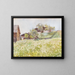 Farmhouses with a white flowering field in front - Marie Egner — framed artwork on a wall