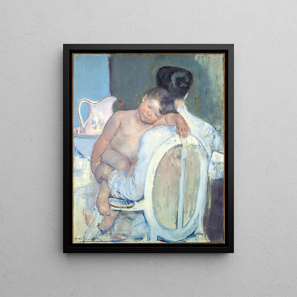 Woman sitting with a child in her arms - Mary Cassatt — framed artwork on a wall