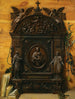 a trompe-l'œil still life of a portable wooden altar with a rosary, a hand bell, and books placed on the edge - Prospero Mallerini — artwork view