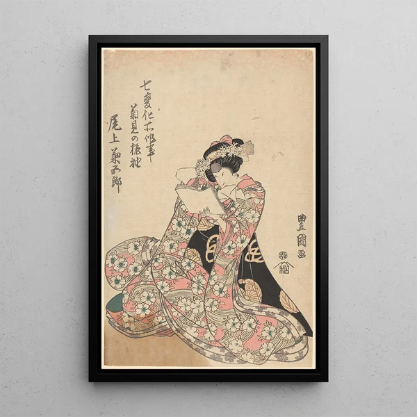 Woman in a floral kimono reading a letter - Toyokuni Utagawa — framed artwork on a wall