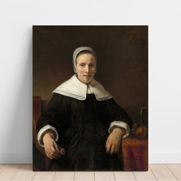 Reproduction of the painting of a woman holding a rose - Rembrandt van Rijn