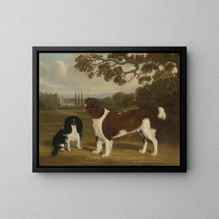 A toy spaniel and a springer spaniel in a landscape with a church in the distance - William Nedham — framed artwork on a wall