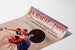 Vintage Brittany – La Baule‑les‑Pins poster displayed on a curled sheet, shown in perspective.