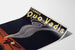 Vintage Quo Vadis Cigars advertising poster, shown on a curled sheet, perspective view.