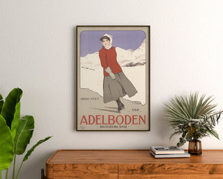 Vintage Switzerland – Adelboden – Carlo Pellegrini, 1905, framed above a wooden sideboard between plants.