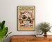 Vintage travel poster – Amsterdam, Marken and Volendam, framed above a wooden sideboard between plants.