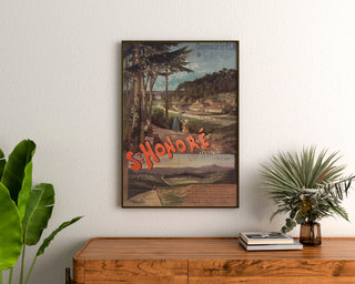 Vintage tourist poster – Saint-Honoré-les-Bains, PLM, framed above a wooden dresser, between plants.