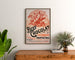 Vintage poster Beef Chocolat, chocolaterie de la Drôme, framed above a wooden dresser between plants.