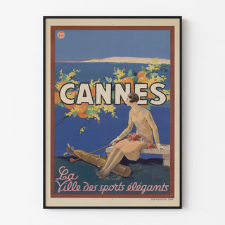 Vintage Cannes poster, Les Sports Élégants, displayed in a slim frame on a light wall.