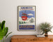 Vintage Gourette Télévoiture poster, framed above a wooden dresser between plants.