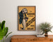 Vintage poster La Sardine française, Béziers, framed above a wooden dresser between plants.