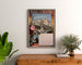 Vintage Lourdes Chemins de fer du Midi poster, framed above a wooden dresser between plants.