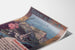 Vintage Lourdes seaside poster shown on a curved sheet, viewed in perspective.