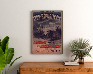 Vintage poster Lyon Républicain, Bataillon Croix‑Rousse, framed above a wooden dresser, flanked by plants.
