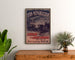 Vintage poster Lyon Républicain, Bataillon Croix‑Rousse, framed above a wooden dresser, flanked by plants.