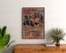 Vintage poster Neuilly, Flower Festival, 1894, framed above a wooden dresser, between plants.