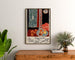 Vintage Nice poster, Travail et Joie, framed above a wooden dresser between plants.