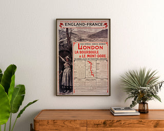 Vintage South Eastern England–France poster, framed above a wooden dresser, between plants.