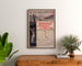 Vintage South Eastern England–France poster, framed above a wooden dresser, between plants.