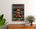 Vintage Thonon-les-Bains poster, framed above a wooden dresser, between plants.
