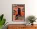 Vintage tram poster Paris–Arpajon, framed above a wooden dresser, between plants.