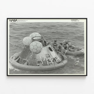 Historical Poster: Apollo 11 Capsule and Astronauts in Rescue Raft — framed artwork on a wall