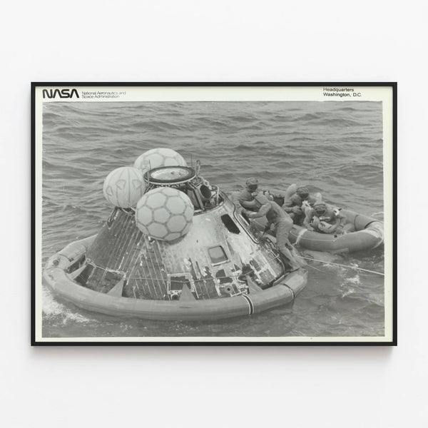 Historical Poster: Apollo 11 Capsule and Astronauts in Rescue Raft — framed artwork on a wall