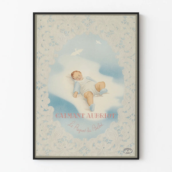 Vintage poster of a sleeping baby framed with lace