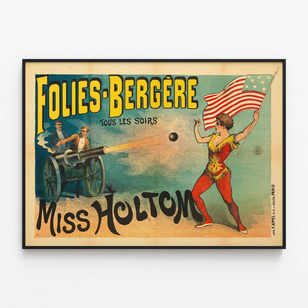 Folies Bergère Poster with Miss Holtom and fire cannon — framed artwork on a wall