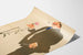 Vintage artistic poster of a man in a suit holding a flower