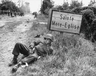 American paratrooper resting near Sainte-Mère-Église | Art print of historic photo — artwork view