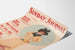 Vintage poster of Sunday Journal with an elegant woman holding a flower