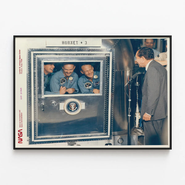 Historical Apollo 11 poster with President Richard Nixon and the astronauts — framed artwork on a wall