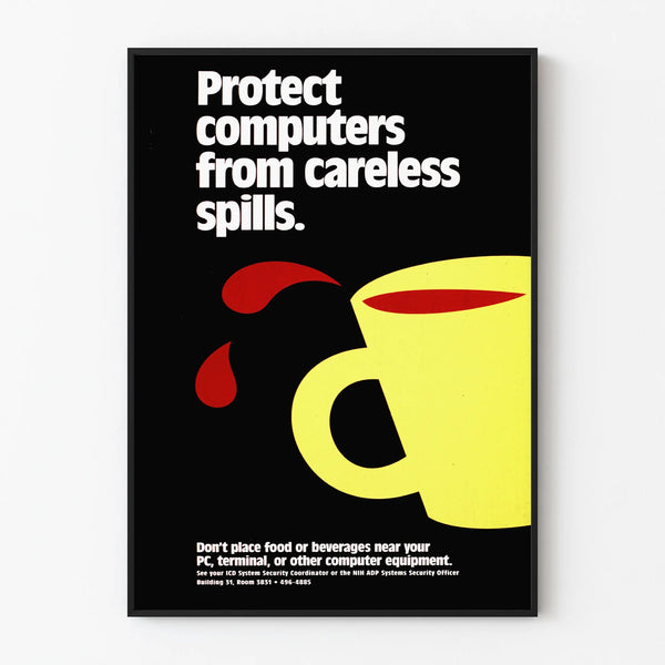 Anti-spill prevention poster near computers