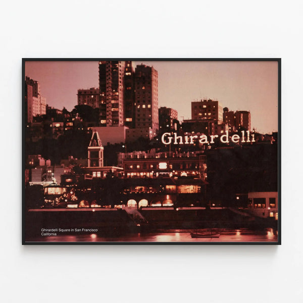 Vintage poster of Ghirardelli Square in San Francisco at dusk — framed artwork on a wall