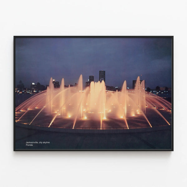 Illuminated Fountain Poster and Jacksonville Skyline in the Evening — framed artwork on a wall