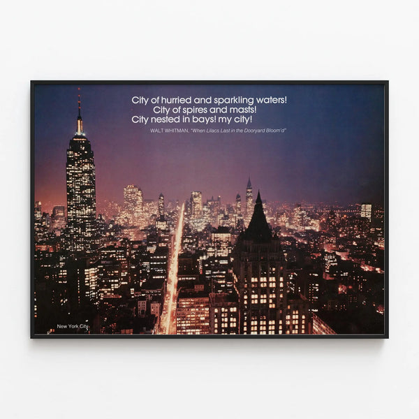 Nighttime New York City poster with quote by Walt Whitman — framed artwork on a wall