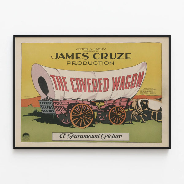 Vintage poster The Covered Wagon retro wall decoration — framed artwork on a wall