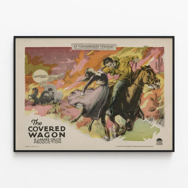 Vintage poster The Covered Wagon for wall decoration — framed artwork on a wall