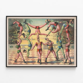 Vintage poster of male acrobats balancing — framed artwork on a wall